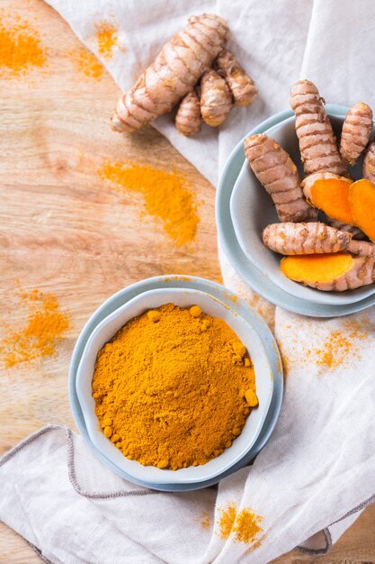 food-drink-diet-nutrition-health-care-concept-raw-organic-orange-turmeric-root-powder-curcuma-longa-cooking-table-indian-oriental-low-cholesterol-spices_419307-1623.jpg