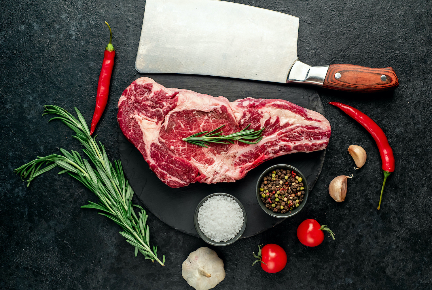 raw-cowboy-beef-steak-on-stone-background.jpg